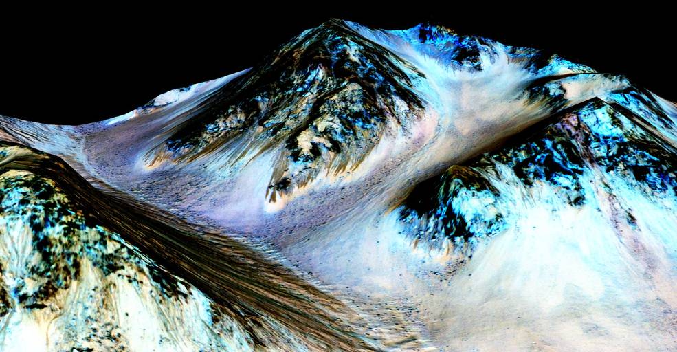 These dark, narrow, 100 meter-long streaks called recurring slope lineae flowing downhill on Mars are inferred to have been formed by contemporary flowing water. Recently, planetary scientists detected hydrated salts on these slopes at Hale crater, corroborating their original hypothesis that the streaks are indeed formed by liquid water. The blue color seen upslope of the dark streaks are thought not to be related to their formation, but instead are from the presence of the mineral pyroxene. The image is produced by draping an orthorectified (Infrared-Red-Blue/Green(IRB)) false color image (ESP_030570_1440) on a Digital Terrain Model (DTM) of the same site produced by High Resolution Imaging Science Experiment (University of Arizona). Vertical exaggeration is 1.5. Credits: NASA/JPL/University of Arizona